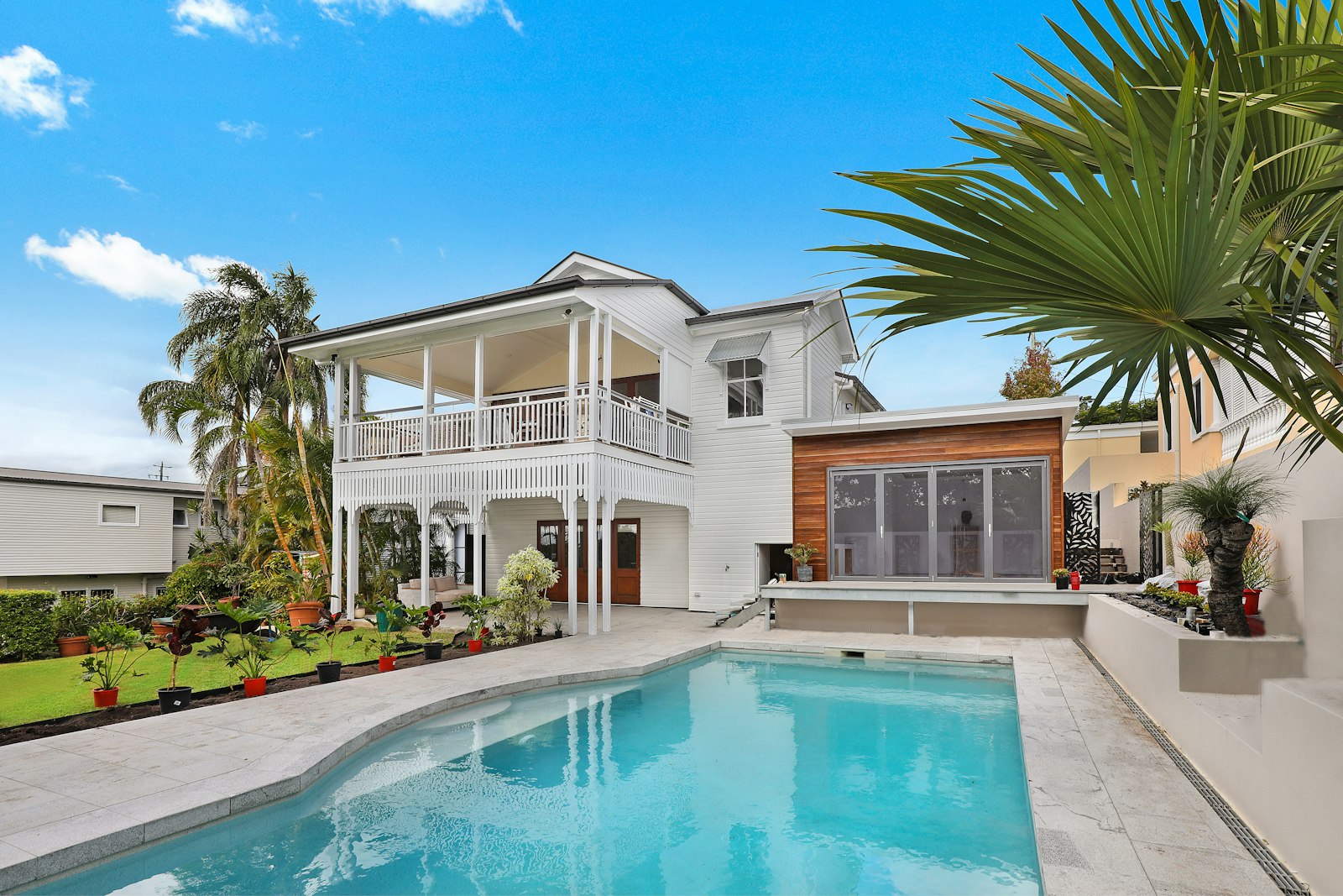 Coastal house with a pool and palms
