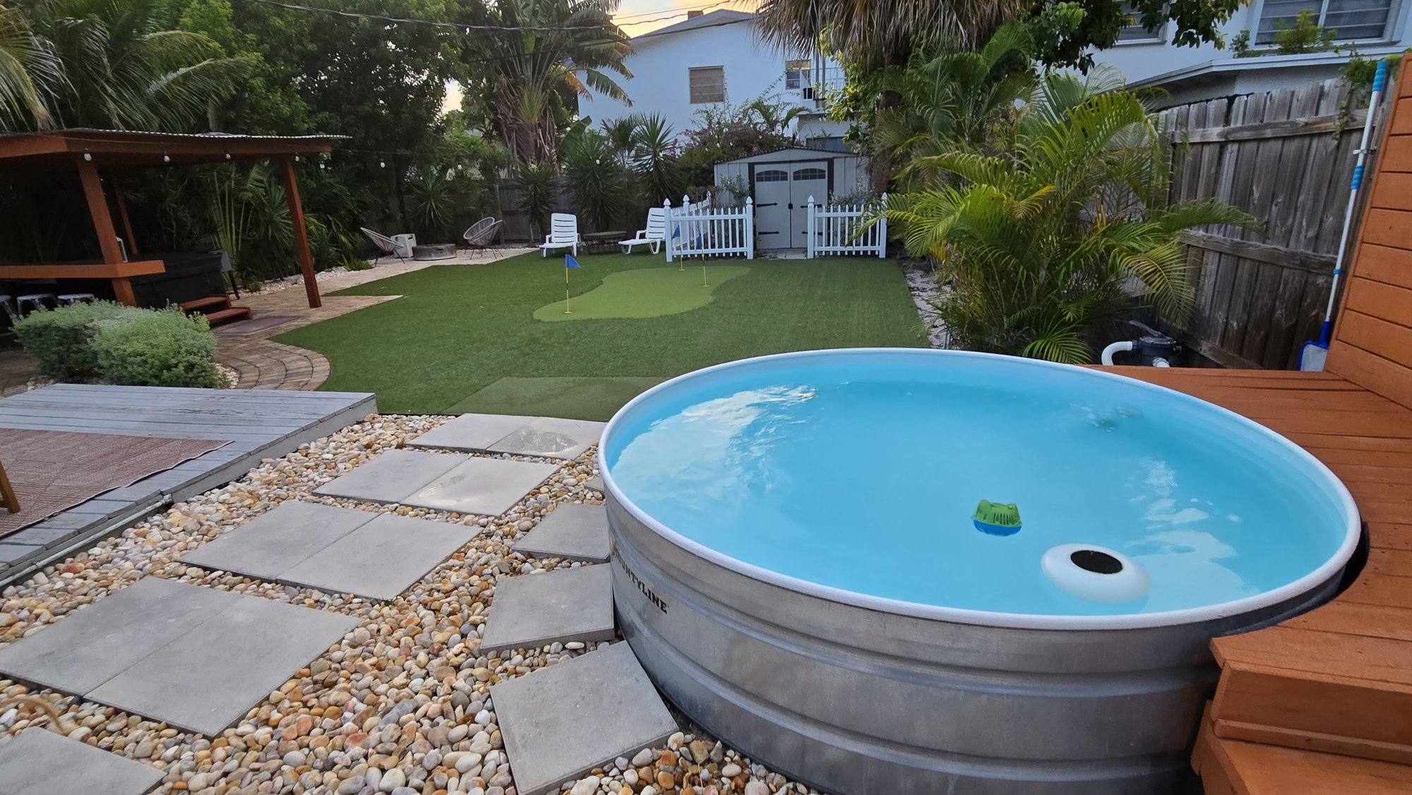 Finished patio pavers around a stock-tank pool